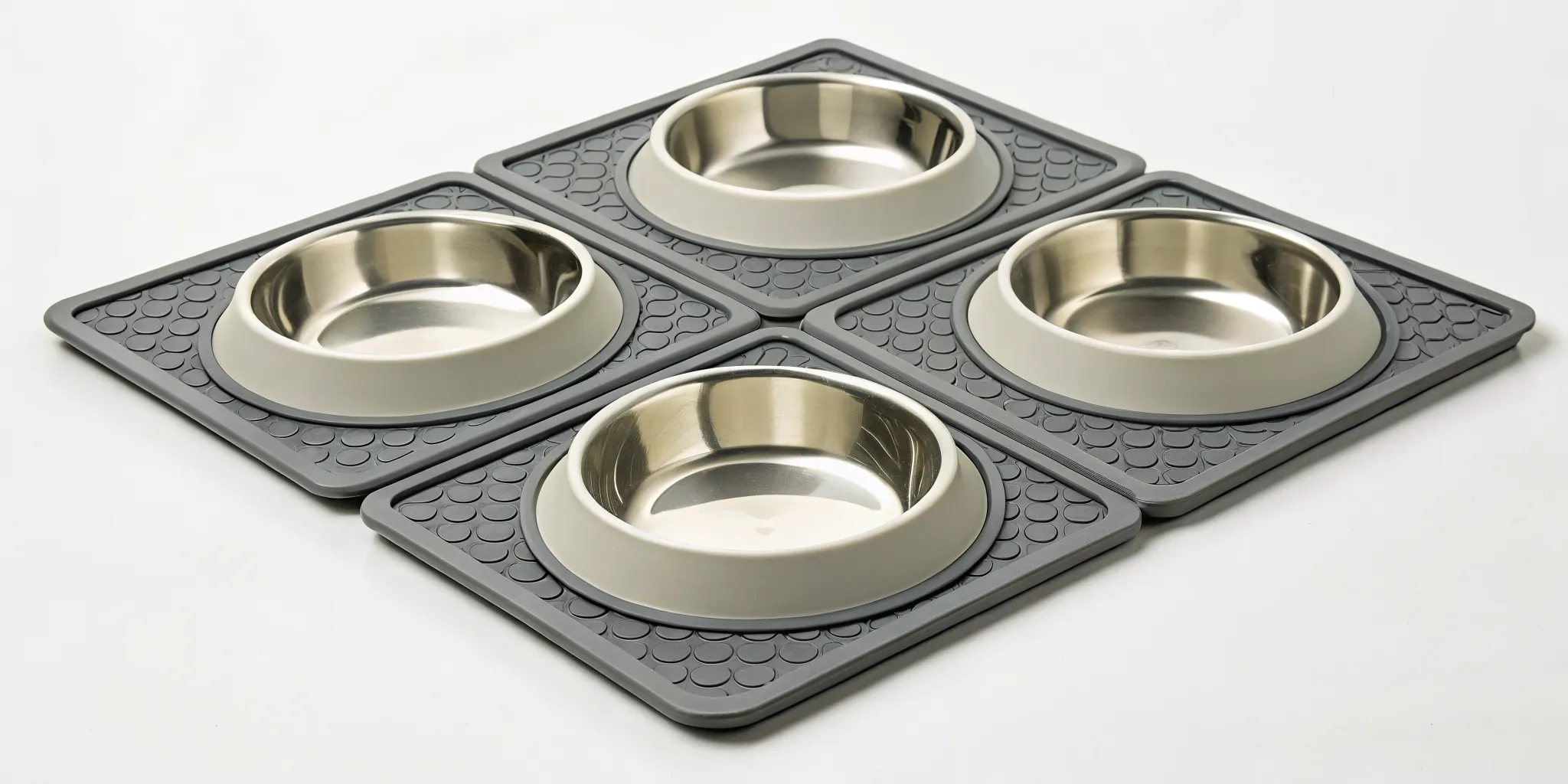 A non-slip dog bowl mat with stainless steel bowls to contain spills from a messy eater.